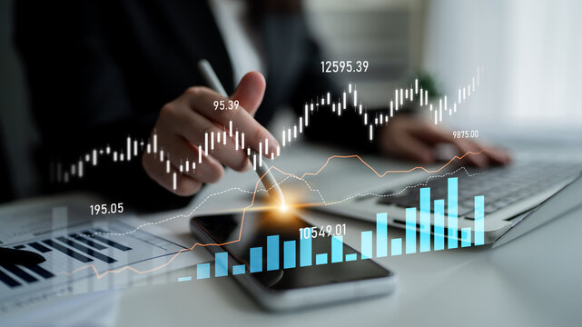 A business professional engages in financial analysis, utilizing digital tools and visual data to interpret growth metrics and develop strategic plans in a modern office setting. Scalp