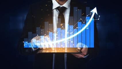 A professional businessman in a suit holds a tablet displaying an upward graph, symbolizing financial growth, success, and excellence in business strategies. Scalp