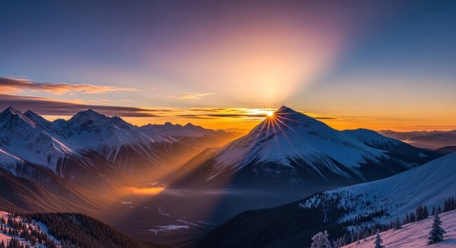 Sunrise over a snow-covered mountain range with snow-covered peaks and a clear sky.