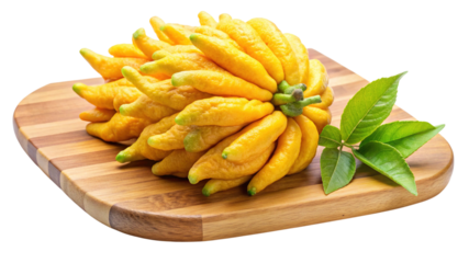 Buddha's hand citron fruit with green leaves on a wood board