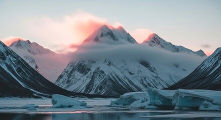 Majestic snow-capped mountains and icy waters under a cloudy sky.