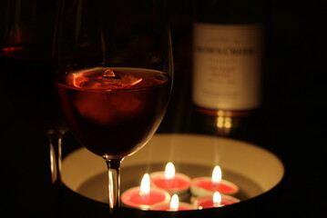 Romantic dinner with candlelight and tasty wine with ice 