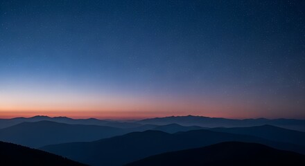 Serene mountain landscape at twilight with a gradient of deep blue to soft orange sky above silhouetted peaks