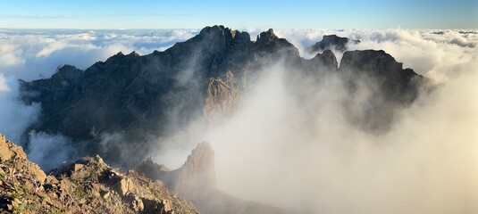 Panorama. Madeira Peaks (Macico Central) over clouds from Pico Ruivo on sunset. Madeira island, Portugal
