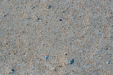 Smooth gray sand texture in soft light.