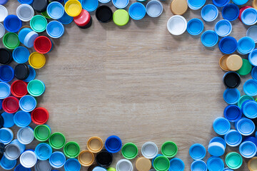 Close up plastic bottles caps for recycling to conserve the environment, recycling, reuse, garbage disposal, save the world concept with copy space