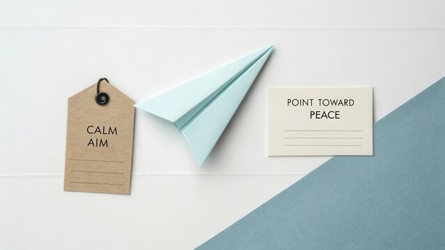 Crafting Tranquility with Inspirational Messages and Paper Airplane on Minimalist Background