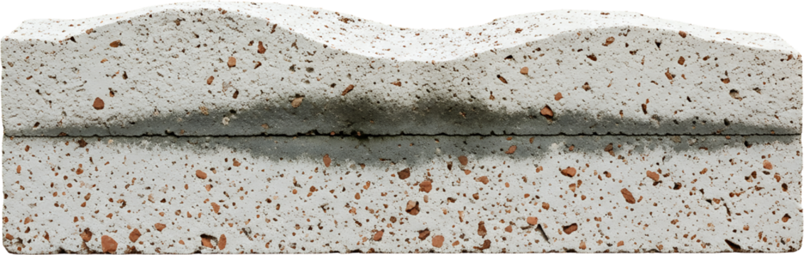 Detailed close up of a textured porous concrete building block featuring embedded aggregate and a dark horizontal joint line
