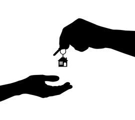 A woman’s hand holding a key symbolizing giving or receiving a home