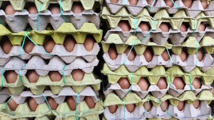 Eggs stacked neatly in cartons for sale at a market