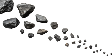 A scattering of dark grey jagged rocks of various sizes on a transparent background stones scattered rough textured mineral