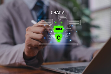 Professional hand interacting with glowing chatbot AI interface on laptop, illustrating modern artificial intelligence, digital communication, machine learning technology, and innovative virtual.