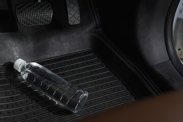 Drinking water in the car prepared for traveling