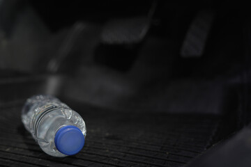 Drinking water in the car prepared for traveling