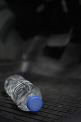 Drinking water in the car prepared for traveling