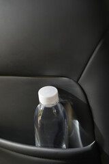 Drinking water in the car prepared for traveling