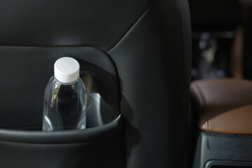 Drinking water in the car prepared for traveling