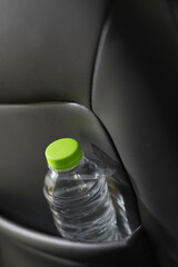 Drinking water in the car prepared for traveling