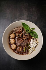 Thai Boat Noodles (Kuay Teow Reua) with Blood Soup, pork, Meatballs, and Basil
