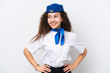 Airplane stewardess Arab woman isolated on white background posing with arms at hip and smiling