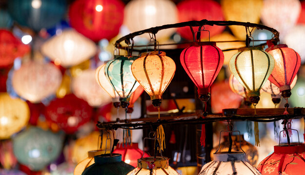 Colorful lanterns illuminating night market in hoi an, vietnam - Powered by Adobe