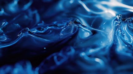 Blue viscous liquid creating abstract waves and ripples