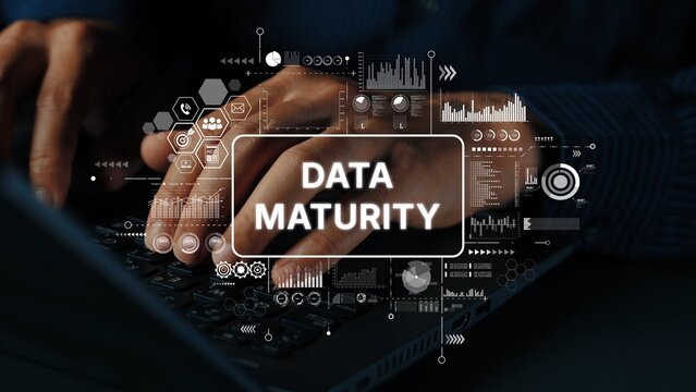 Hands Typing on Laptop with Data Maturity Concept Visual Overlays and Digital Elements. Asymptotic smart data analytic.