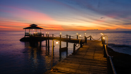 Stunning sunset view from a wooden pier on Koh Kood Island in Thailand