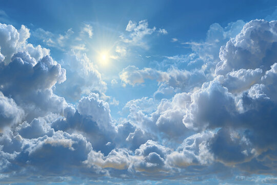 The bright sun shines through dramatic cumulus clouds in a vast blue sky with birds flying in the distance - Powered by Adobe