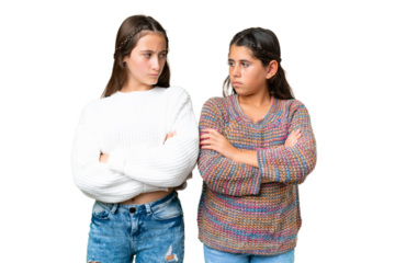 Friends girls over isolated chroma key background annoyed angry in furious gesture