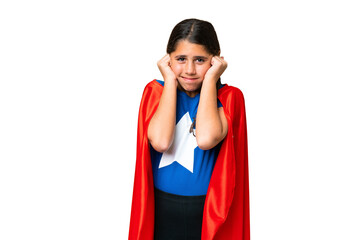 Super Hero girl over isolated chroma key background frustrated and covering ears © luismolinero