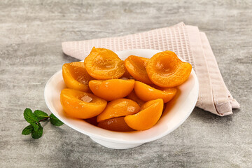 Sweet canned apricots with syrope
