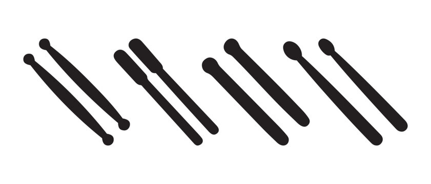 Various drumsticks and mallets for percussion musical instruments.