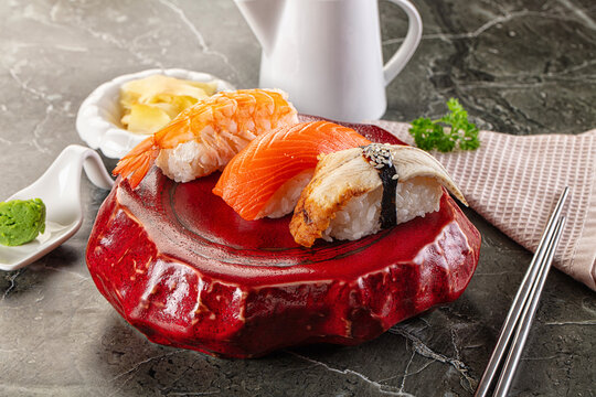 Japanese cuisine - sushi with eel, salmon and prawn