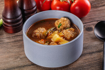 Tomato Soup with meatballs and vegetables
