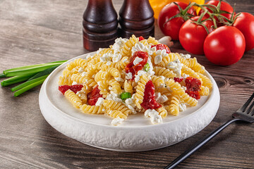 Italian pasta fusili with curd