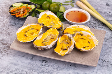 Baked oyster with cheddar cheese