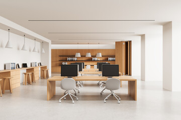 Modern open space office interior with wooden furniture, minimalist design, and neutral tones in a...