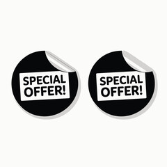 Two black circular stickers with special offer text