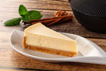 Classic delicous cheesecake slice served mint