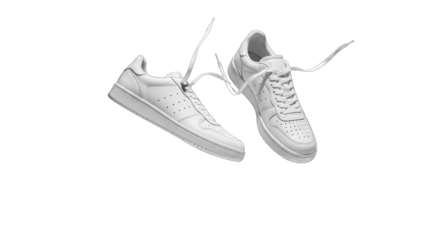 Two white sneakers with untied laces isolated on a transparent background
