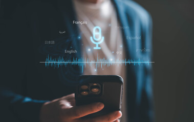  Business person using AI voice command with smartphone to create voice prompt for process automation without typing. Artificial intelligence for voice bot command technology.