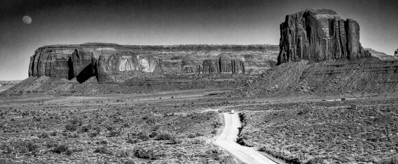 Monument Valley desert landscape captured in monochrome highlighting textures and shadows of rocks © jovannig
