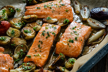 One sheet pan - roasted salmon fillet with vegetables in baking tray