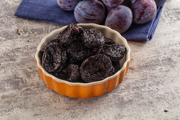 Black dry sweet prunes heap