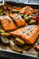 One sheet pan - roasted salmon fillet with vegetables  in baking tray