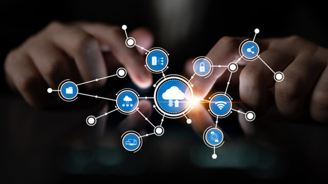 Close-up of hands using a smartphone with digital cloud icons, illustrating concepts of networking, communication, and data management in a modern technological environment. Tessel
