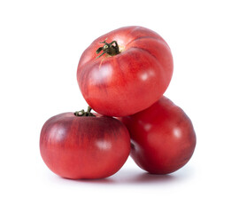 Organic dark red tomatoes close up isolated on a white background
