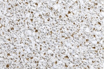 Close Up of White Quartz Surface with Brown Flecks and Speckles