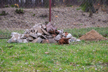 Piles of Stones and Dirt in Yard